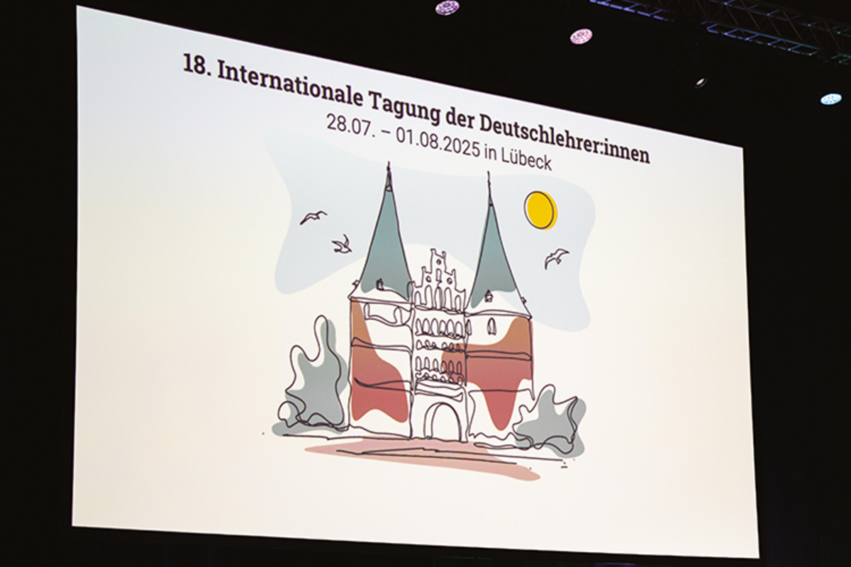 Das Bild zeigt einen Slider, auf dem ein Willkommensgruß zur 18. IDT steht.